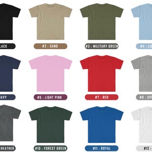 May include: Twelve different colour t-shirts, each with a number and colour name. The colours are black, sand, military green, light blue, navy, light pink, red, sport grey, dark heather, forest green, royal blue, and white.