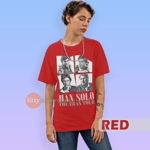 May include: Red t-shirt with a graphic of four different images of Han Solo from the Star Wars movies. The text "Han Solo The Eras Tour" is printed on the shirt.