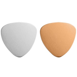 May include: Two guitar picks, one silver and one copper, in a triangular shape.