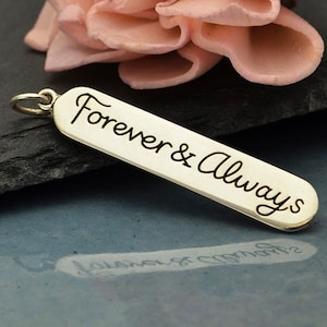 May include: Silver charm with the words "Forever & Always" engraved on it.