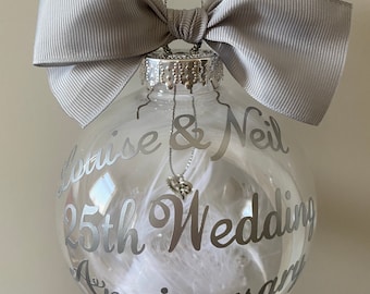 25th Anniversary Bauble Gift. Personalised Names and wedding date or year. Hanging heart charm inside. Available in any colours.