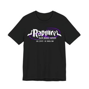 May include: Black t-shirt with the word "Rapture" in white gothic font, encircled by a purple oval. Below, the text reads "dark music culture" and "est. 2005 - st. louis, mo."