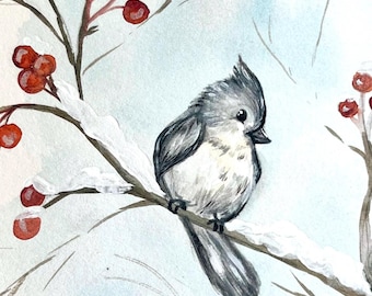 May include: A watercolour painting of a small grey bird perched on a snow-covered branch with red berries. The background is a light blue watercolour wash.