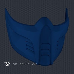 May include: A dark blue, stylized mask with a futuristic design. The mask features sharp angles, vents, and a prominent central ridge. The logo "RW 3D STUDIOS" is visible at the bottom. The mask is likely for cosplay or costume use.