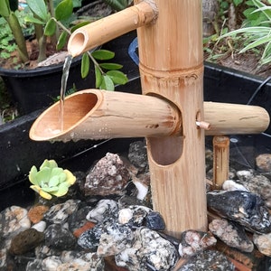 Shishi odoshi fountain japanese style with rocking bamboo, outdoor fountain japanese style, handmake fountain from real bamboo.
