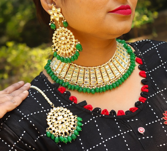 Gold plated necklace with earrings and tikka Our prices are in US