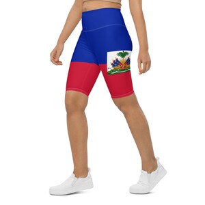 May include: A pair of blue, red, and green high-waisted athletic shorts with the flag of Haiti printed on them.