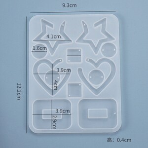 May include: A clear silicone mold for making earrings. The mold has 10 different shapes, including stars, hearts, and squares. The mold is 9.3 cm wide, 12.2 cm tall, and 0.4 cm thick.