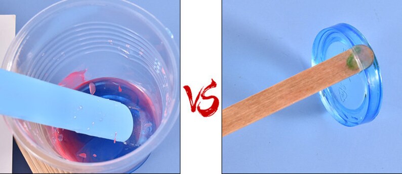 May include: A blue and red resin mixture is being stirred with a blue plastic stick in a clear plastic cup.  The same stick is shown resting on top of a blue plastic lid.