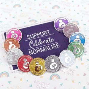 May include: A set of ten silver and glitter-covered pins with the words "Breastfeeding Milestone Award" on each. The pins are arranged in a circle on a purple background with the words "Support Celebrate Normalise" printed on it.