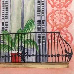 May include: A watercolor painting of a window with white shutters and a balcony with a black railing. A potted plant with green leaves is on the balcony. The wall behind the window is painted pink with a repeating pattern of red flowers.