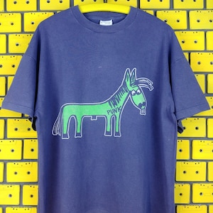 May include: A navy blue t-shirt with a green cartoon donkey wearing a hat and the word "Punk" written on it.