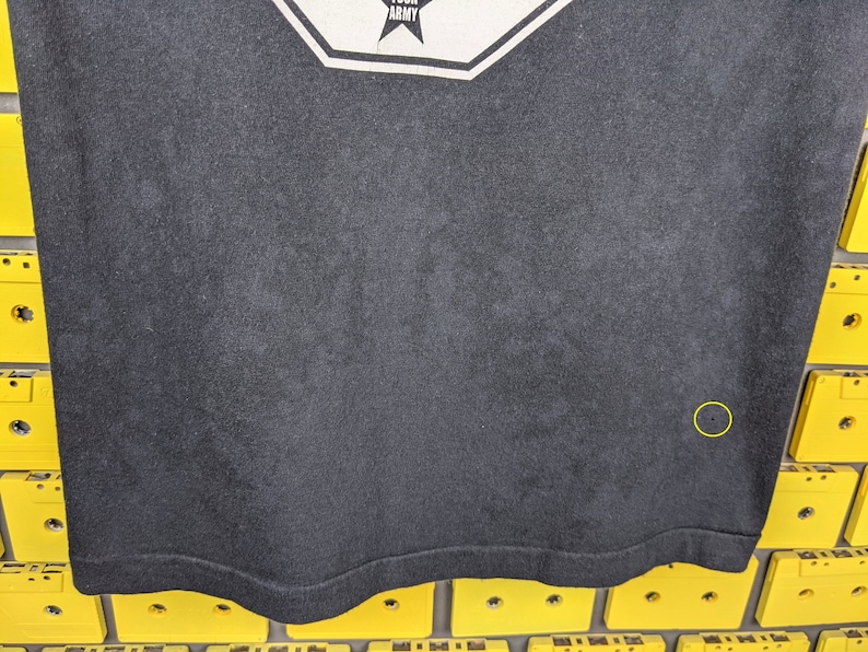 May include: Black t-shirt with a white graphic of a star and the word "Army".