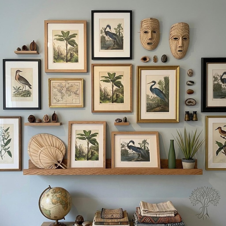 Home office oak shelf, with wall art and nature photos on a soft blue wall.