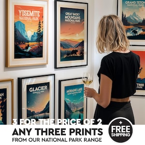 May include: Framed art prints featuring national park landscapes, including Yosemite, Great Smoky Mountains, Glacier, and Moraine Lake. The prints showcase vibrant colors and scenic views. Text on the image reads "3 for the price of 2" and "Any three prints from our national park range."