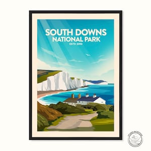 May include: A vintage travel poster design featuring the South Downs National Park in England. The poster features a scenic view of white cliffs, a blue ocean, and a small village with houses. The text on the poster reads "South Downs National Park Estd 2010".
