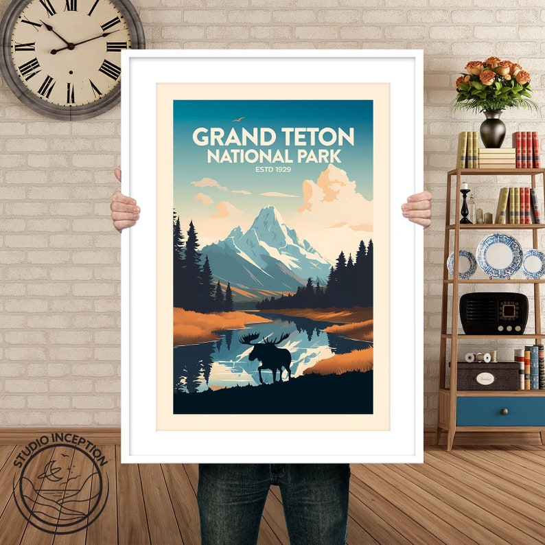 May include: A vintage-style poster featuring a scenic view of Grand Teton National Park, Wyoming. The poster features a mountain range with snow-capped peaks, a lake reflecting the mountains, and a silhouette of a moose in the foreground. The text "Grand Teton National Park" and "Est. 1929" is printed in a retro font.