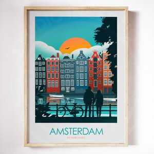 May include: A colorful illustration of Amsterdam, Netherlands, with a couple standing in front of a canal and a bicycle. The illustration features a sunset over a row of traditional canal houses.