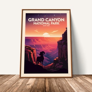 May include: A vintage-style poster featuring a silhouette of a bighorn sheep standing on a cliff overlooking the Grand Canyon. The poster has a sunset sky with a bright orange sun and the text "Grand Canyon National Park Estd 1919".