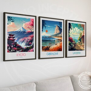 May include: Three framed travel posters with colorful illustrations of Kyoto, Japan, Gibraltar, and Lahaina, Hawaii. The posters have a vintage aesthetic and feature the city name in white text at the bottom.
