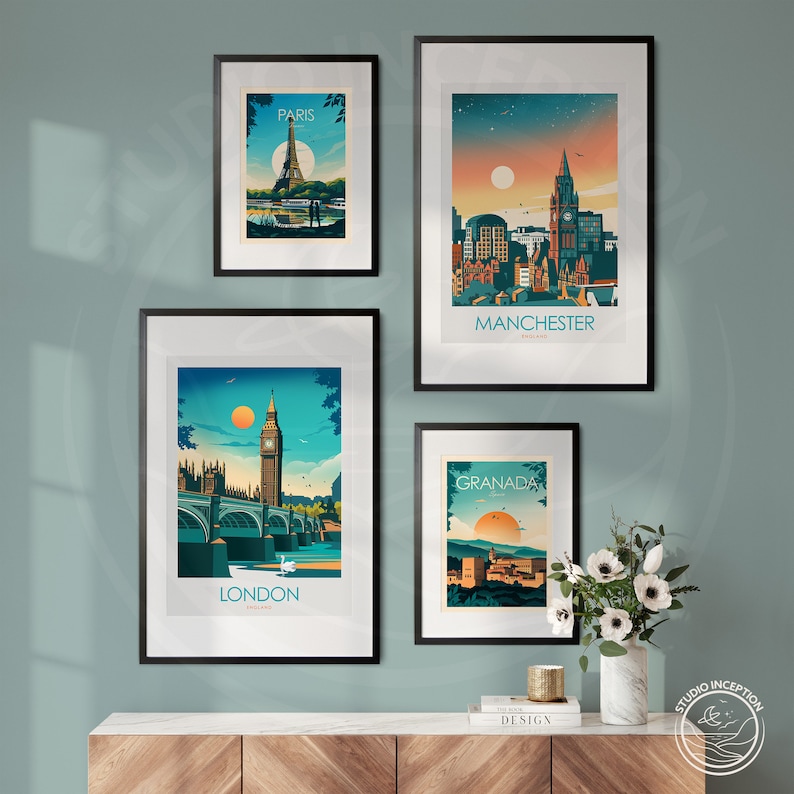 May include: Four framed city skyline prints with a minimalist design. The prints feature the cities of Paris, Manchester, London, and Granada. The prints are displayed on a wooden shelf with a book and a candle.