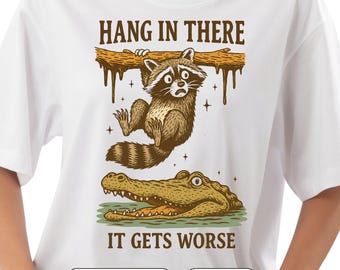 Snarky Raccoon PNG – Hang in There It Gets Worse, Retro Sarcastic Sublimation Design, Funny Aesthetic Raccoon Shirt PNG, High Res Printable.