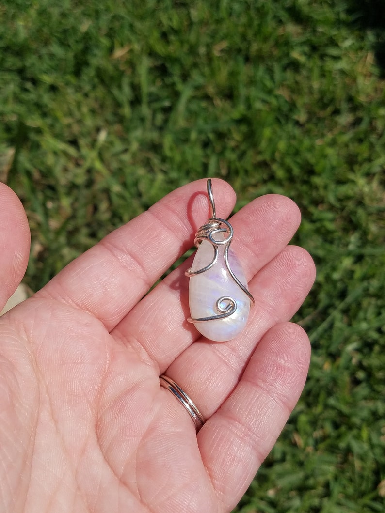 Blue fire rainbow moonstone wire wrapped pendant