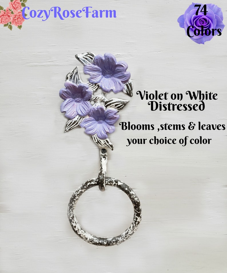 May include: A distressed white metal towel ring featuring three lavender flower blooms and leaves. The text reads "Violet on White Distressed" and "Blooms, stems & leaves your choice of colour".
