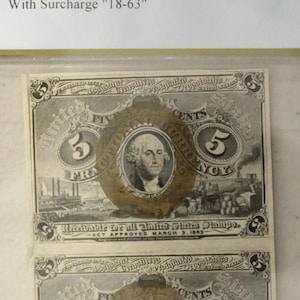 May include: A vertical pair of uncut 5-cent Second Issue Fractional Currency notes. Each note features a portrait of George Washington within an oval frame. The notes are encased in a protective holder with a label indicating the grade and details.