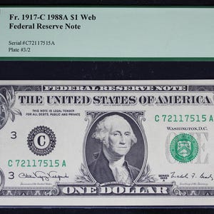 May include: A one-dollar Federal Reserve Note from 1917-C, graded Very Choice New 64PPQ. The note features a portrait of George Washington and the text "THE UNITED STATES OF AMERICA". The serial number is C72117515A.