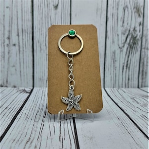 Star Fish v2 Charm Schlüsselanhänger mit dekorativem Split Pin auf Karte