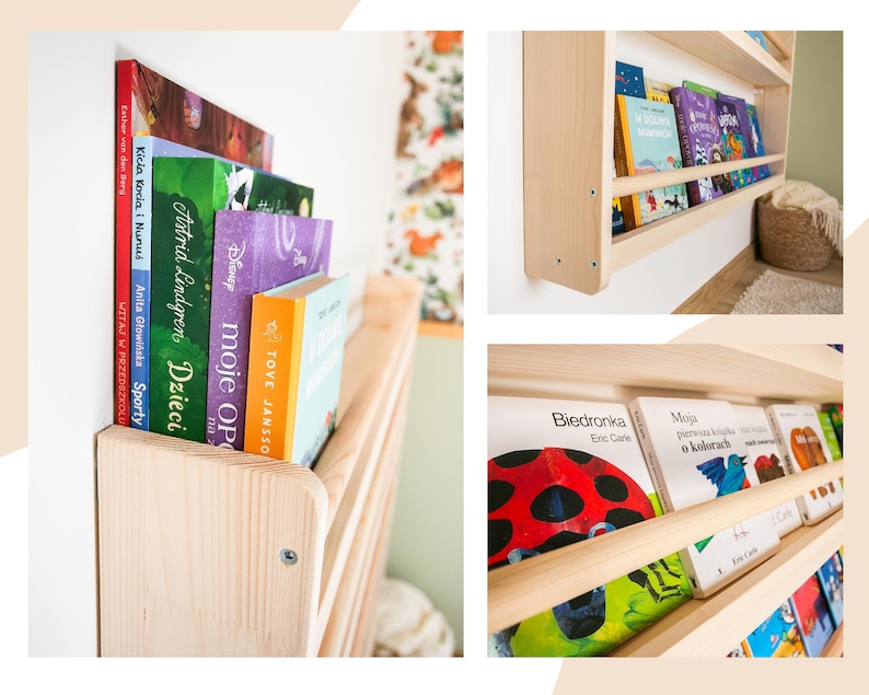 May include: A light-colored wooden wall-mounted bookshelf featuring a horizontal front rail to hold books in place. The shelf is filled with various children's books with colorful spines and covers, including titles like Biedronka and Moja pierwsza książka.