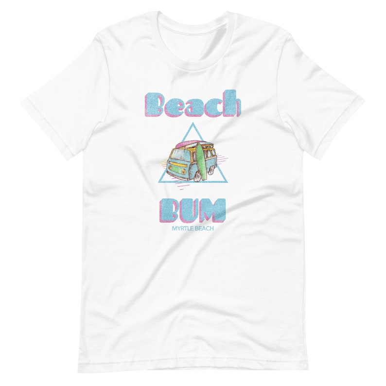 May include: White t-shirt with a blue and pink graphic of a vintage van with a surfboard on top. The text "Beach Bum" is written in blue and pink letters with the words "Myrtle Beach" underneath.
