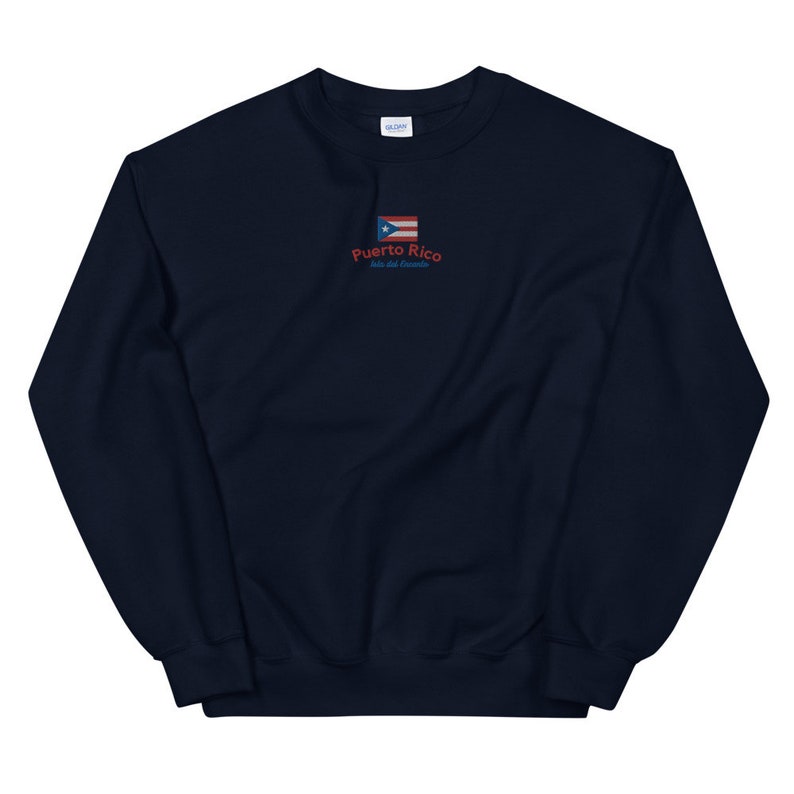 May include: Navy blue sweatshirt with a small embroidered Puerto Rican flag and the text "Puerto Rico, Isla del Encanto".