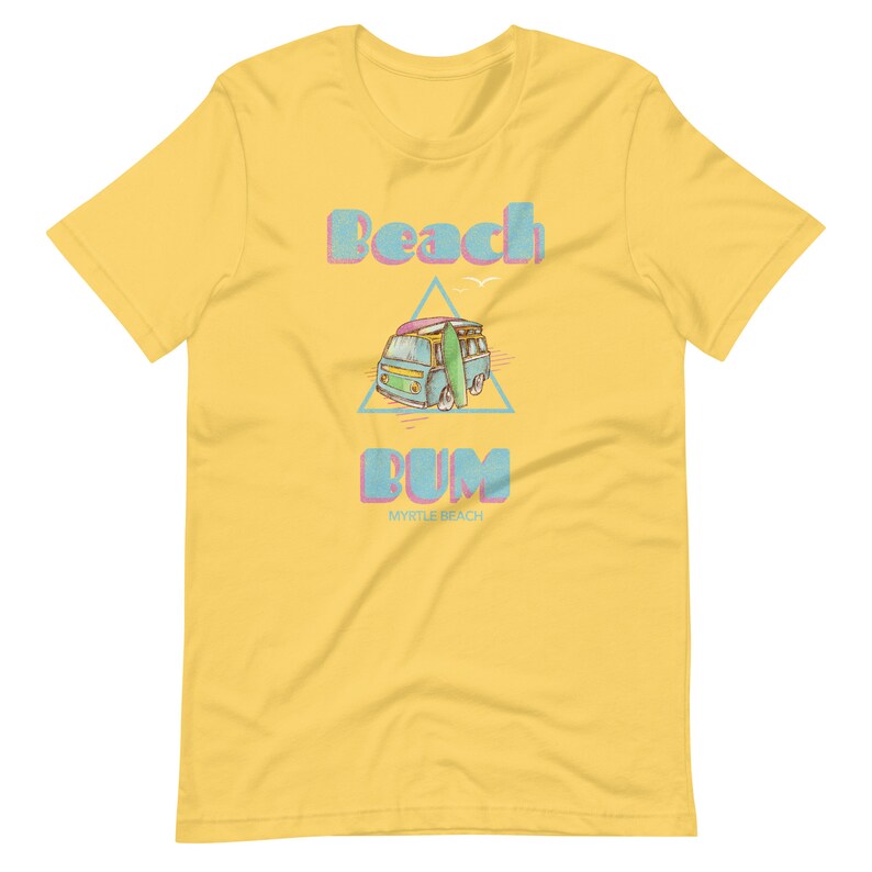May include: Yellow t-shirt with a blue and pink graphic of a vintage van with a surfboard on top. The text "Beach Bum" is above the van and "Myrtle Beach" is below the van.