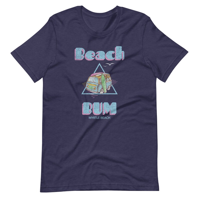 May include: A navy blue t-shirt with a vintage-style graphic of a blue van with a surfboard, a triangle, and the text "Beach Bum Myrtle Beach".