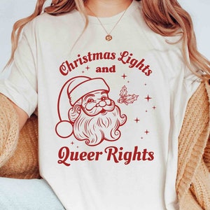 Weihnachtslichter & Queer Rechte Gay Weihnachts-Shirt, Lesben Pride Weihnachten T-Shirt, LGBT Queer Gay süßes Geschenk, Lesben Urlaub Lustiges Unisex T-Shirt