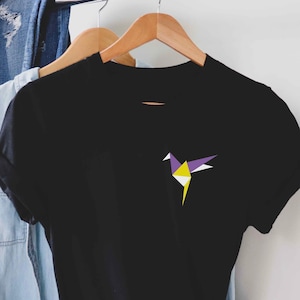 May include: Black t-shirt with a purple, yellow, and white origami bird design.