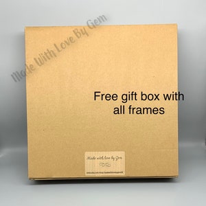 May include: A brown cardboard box with the text "Made With Love By Gem" and "Free gift box with all frames" printed on it. The box also has a sticker that says "Made with love by Gem" and includes a website address.