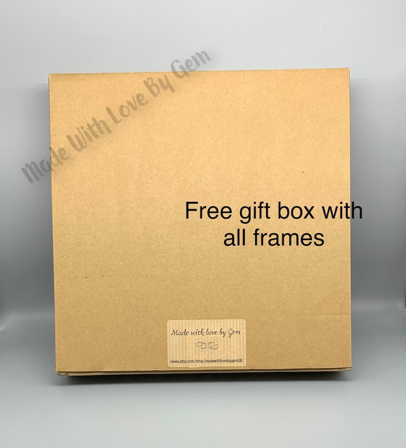 May include: A brown cardboard box with the text "Made With Love By Gem" and "Free gift box with all frames" printed on it. The box also has a sticker that says "Made with love by Gem" and includes a website address.