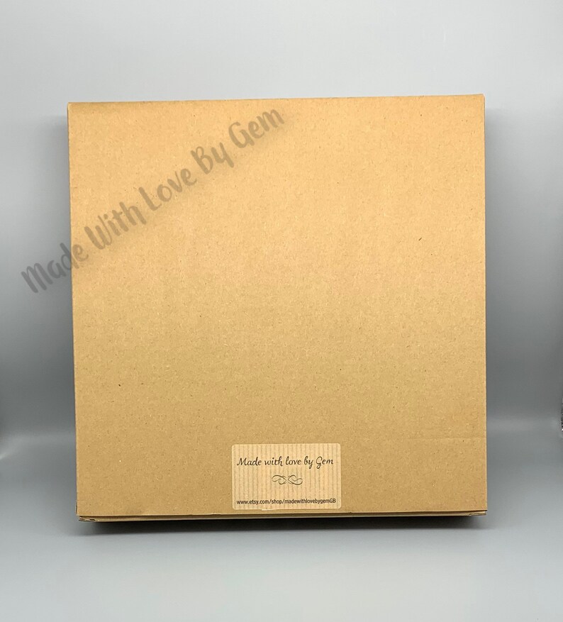 May include: A brown cardboard box with a label that reads "Made with love by Gem" and a website address.