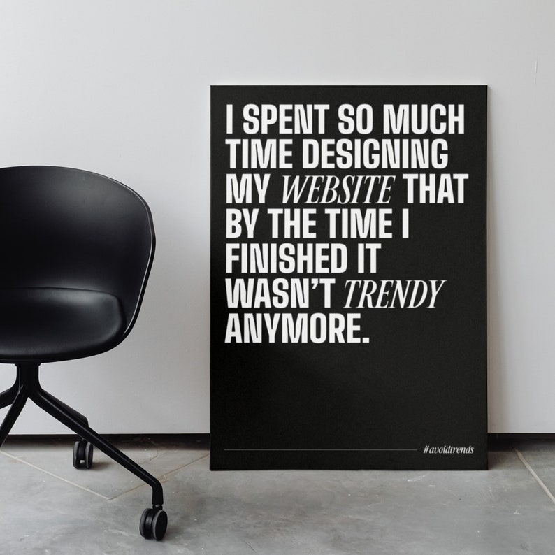 May include: Black and white typography poster with the text "I spent so much time designing my website that by the time I finished it wasn't trendy anymore." The poster has the hashtag "#avoidtrends" at the bottom.