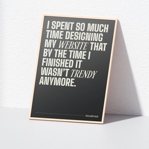 May include: A black and white poster with a white frame. The poster has a quote about website design: "I spent so much time designing my website that by the time I finished it wasn't trendy anymore." The poster also includes the hashtag #avoldtrends.