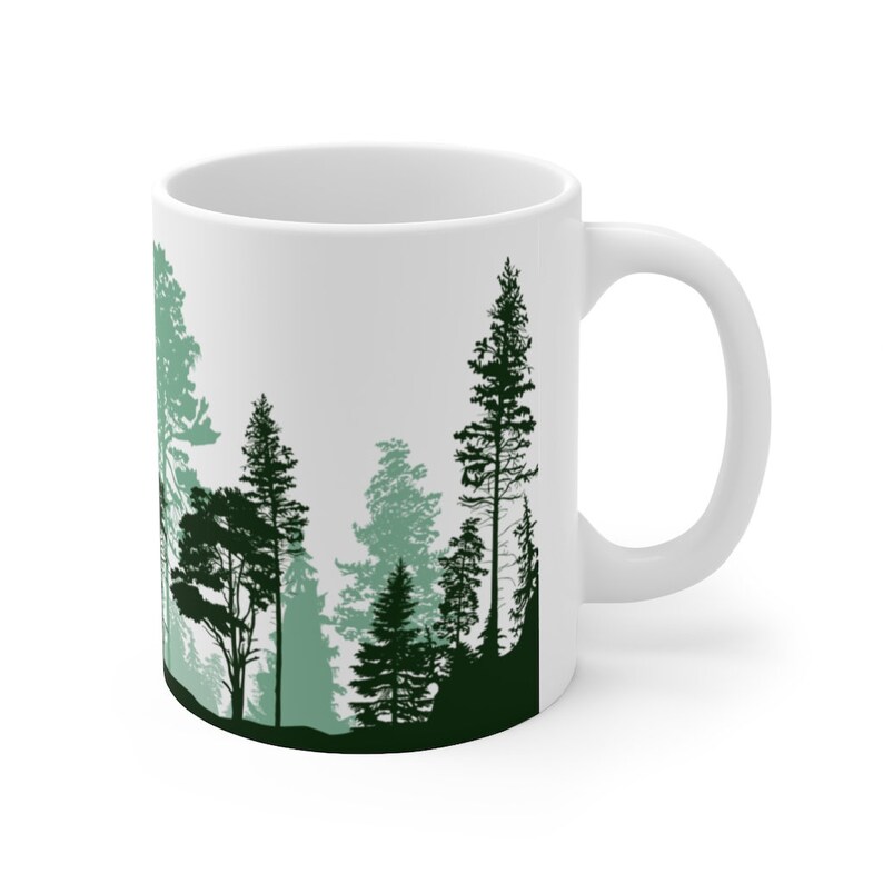Pine Tree tea Mug. Forest artwork silhouettes depicting a beautiful array of natural trees. Shades of Green with evergreens, pine, redwoods and other various natural trees on a ceramic coffee mug