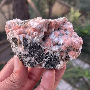 Multiple orange mesolite ball on matrix