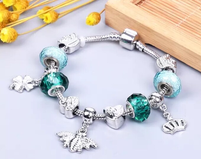 Green and silver charm bracelet