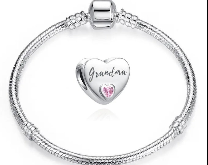 Sterling Silver charm and silver plated bracelet.