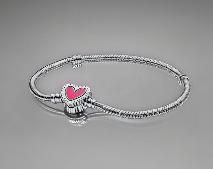 Silver charm bracelet with pink heart