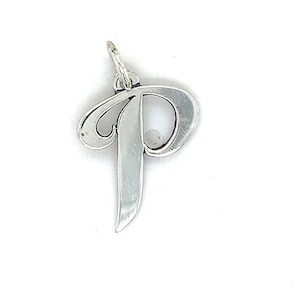 May include: A silver-colored pendant in the shape of the letter "P" in a cursive font. The pendant has a small loop at the top for attaching to a chain or bracelet. The design is simple and elegant, suitable for everyday wear.
