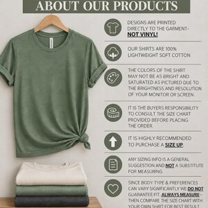May include: A sage green t-shirt hanging on a wooden hanger with a side knot, displayed above a stack of three folded t-shirts in cream, sage green, and charcoal. The image includes text detailing product information, sizing, and care instructions.